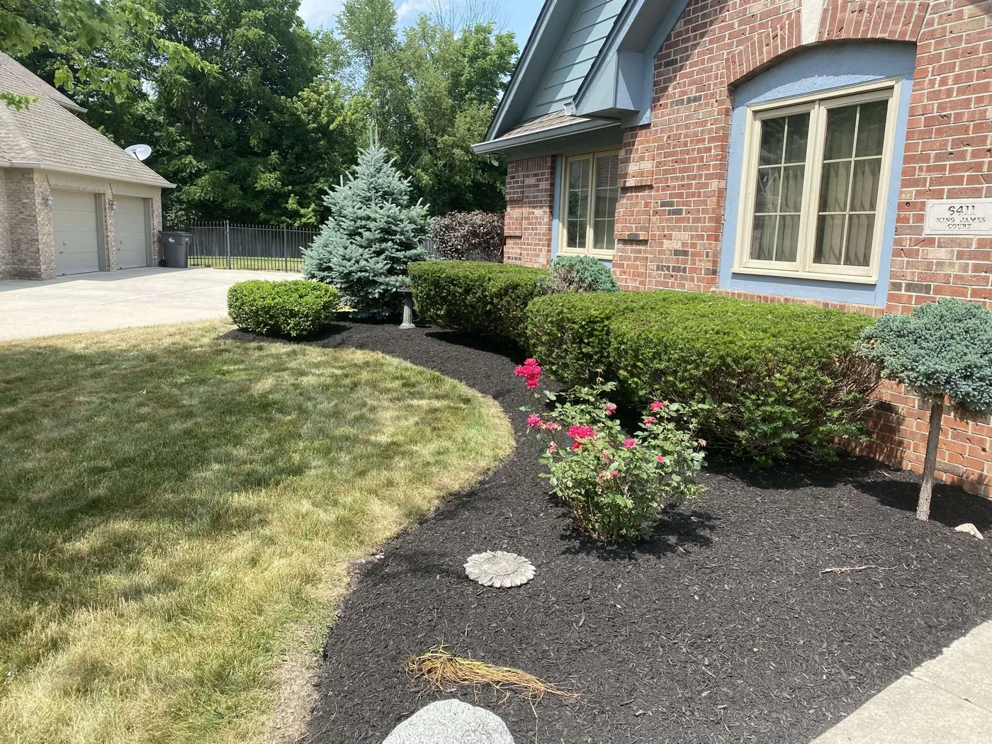 Cleared and edged planting bed after a spring cleanup near Indianapolis, IN