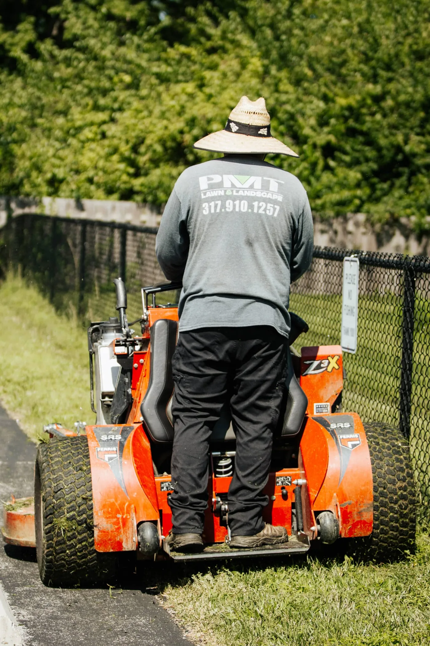 Core aeration underway on a clay soil lawn in Greenwood, IN