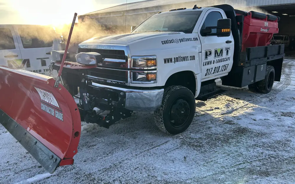 PMT Lawn & Landscape plow truck with salt spreader ready for commercial snow removal