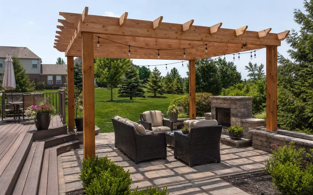 Cedar pergola over a paver patio beside a composite deck in Indianapolis, IN