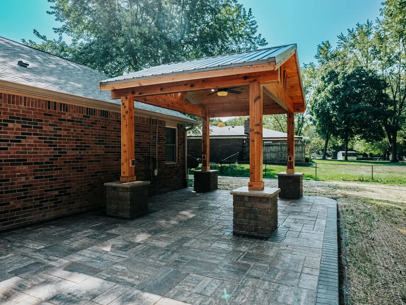 Paver patio and landscape bed installation by PMT Lawn & Landscape